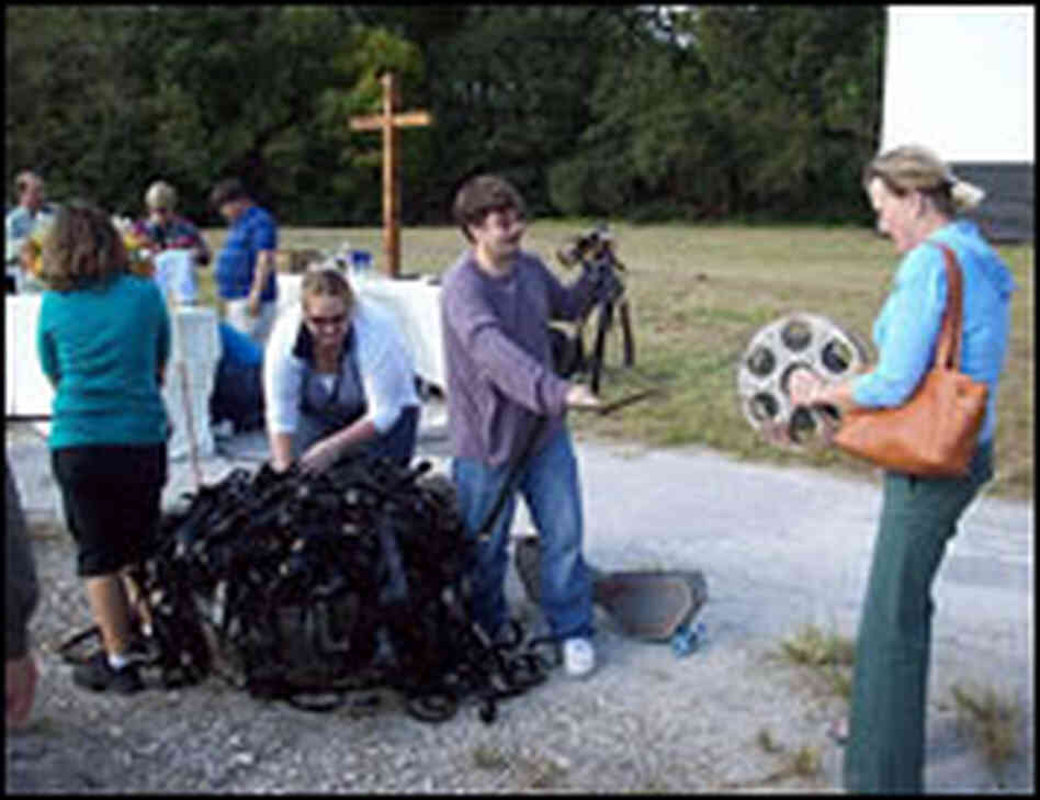 Members of Christ Church Anglican in Jacksonville, Fla., unravel X-rated films Sunday.