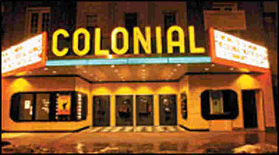 Colonial Theatre marquee at night, neon lit