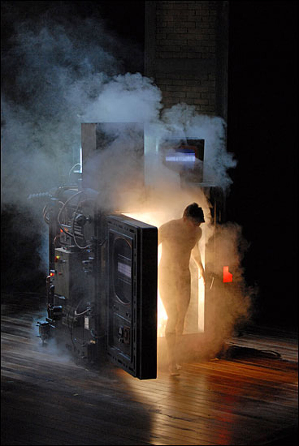 Daniel Okulitch steps out of the transport chamber in a cloud of smoke