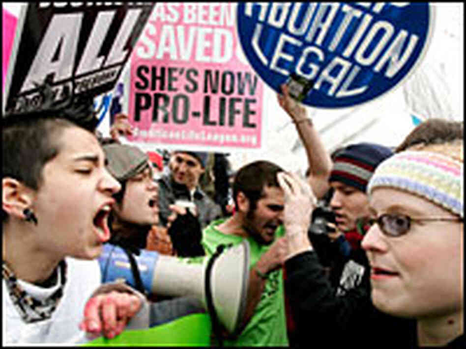 Abortion rights activists argue with abortion opponents.