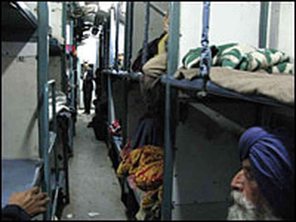 Passengers crowd into a berth on 'the cancer train'