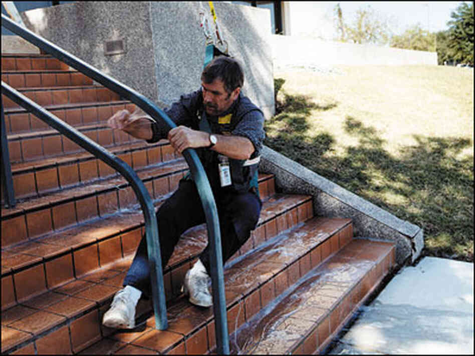 A man slips on a surface sprayed with anti-pirate coating. A man slips on a surface sprayed with anti-pirate coating.