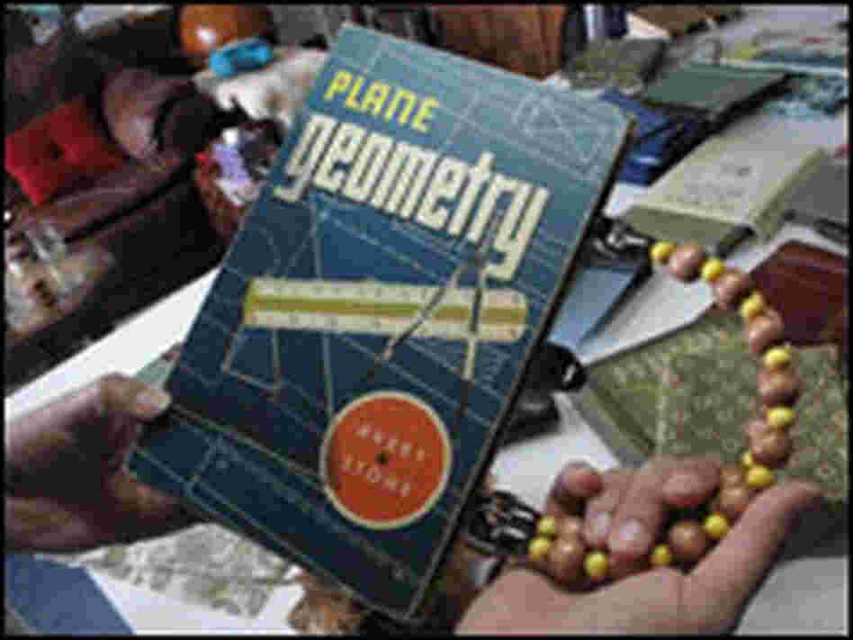 A geometry textbook turned into a purse.