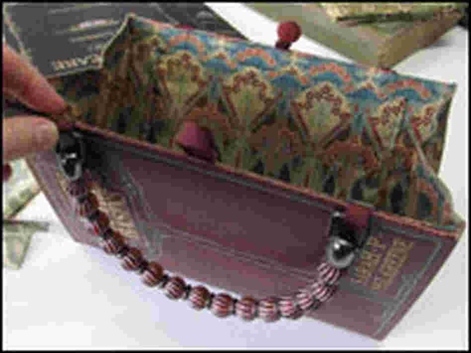 A fabric lining replaces pages of the book.