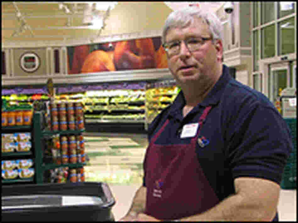 Joel Lueck is a former IT professional who now works as a supermarket cashier. Adam Hochberg/NPR