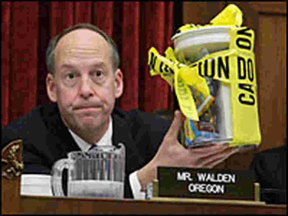 Rep. Greg Waldon holds a jar of candy peanut products