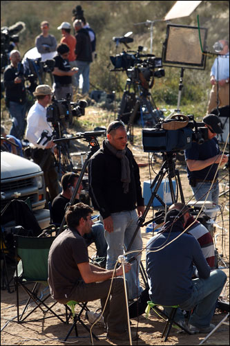 Members of the media report along the Israeli-Gaza border in Israel on Wednesday.