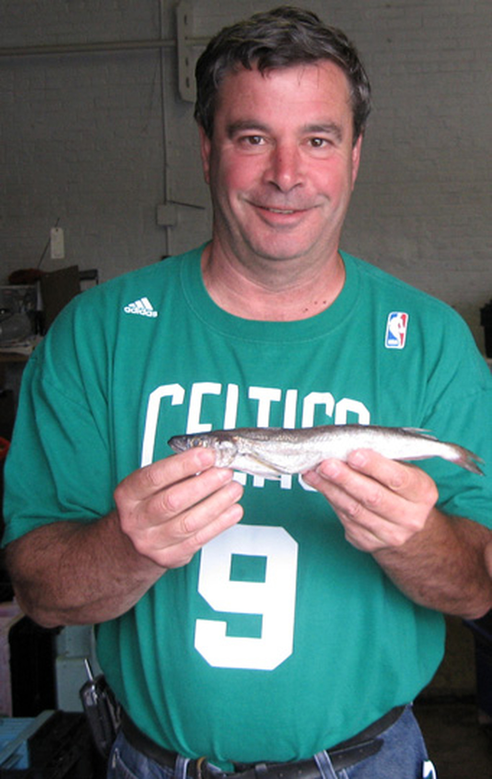 Steve Parkes, a community supported fishery organizer, holds a fish
