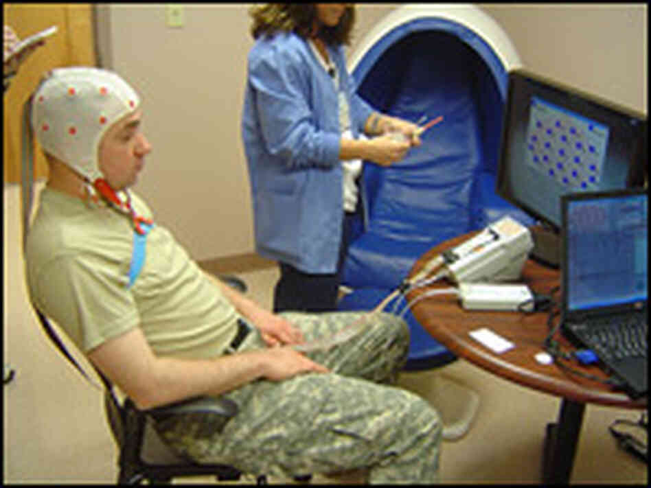 A computer tracks the brain waves of Michael Hensley, who is working on relaxation techniques.