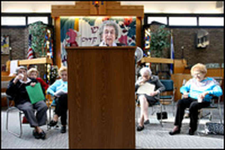 Wish, at the lectern, is one of 10 women ages 89 to 96 who will be bat mitzvahed.