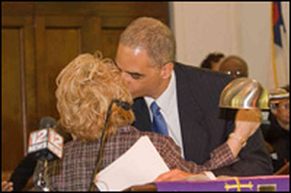 Attorney General Eric Holder kisses Peggy Wallace Kennedy.