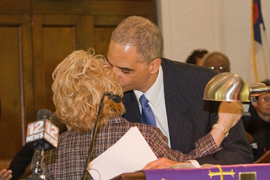 Attorney General Eric Holder kisses Peggy Wallace Kennedy.