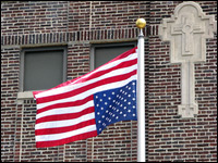 An upside-down flag flies outside of St. Sabina Catholic church and school on Chicago's South Side