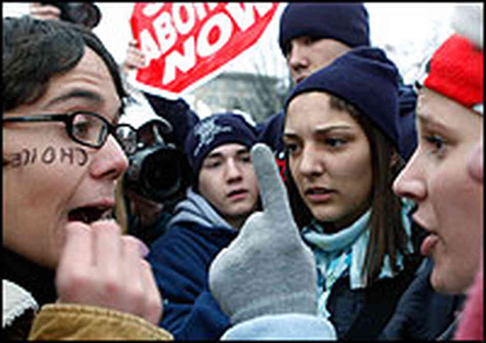 An abortion rights advocate argues with anti-abortion activists outside the Supreme Court. An abortion rights advocate argues with anti-abortion activists outside the Supreme Court.