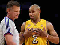 L.A. Laker Derek Fisher with referee Steve Javie. L.A. Laker Derek Fisher with referee Steve Javie.