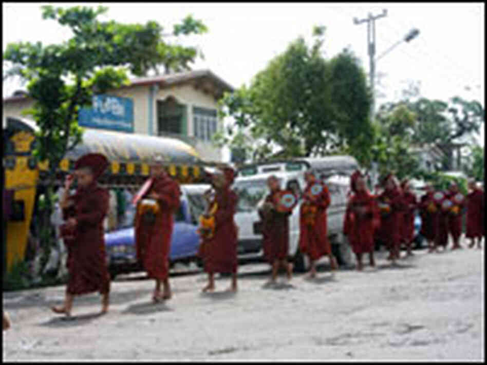Buddhist monks walk to collect food Buddhist monks walk to collect food
