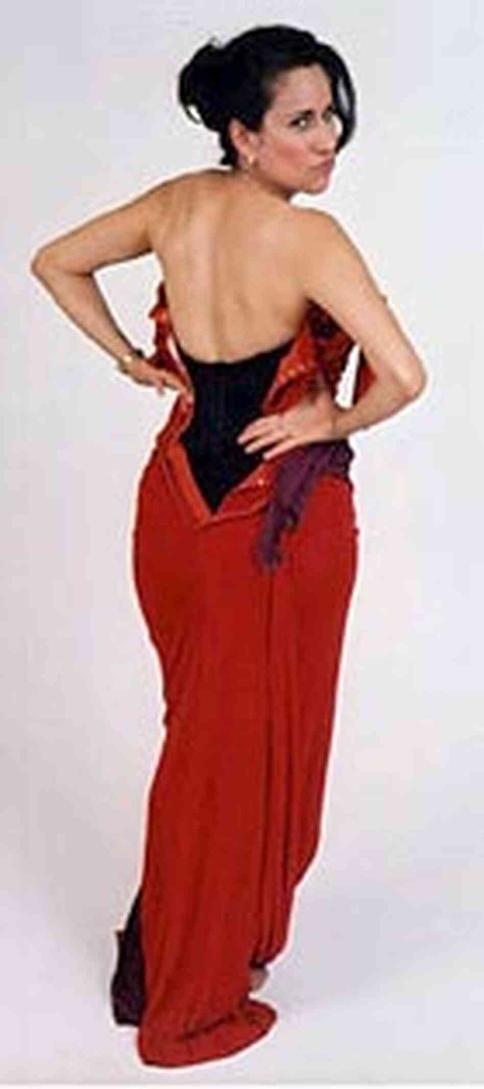 Jessica Seigel tries on Marilyn Monroe's Oleg Cassini gown.