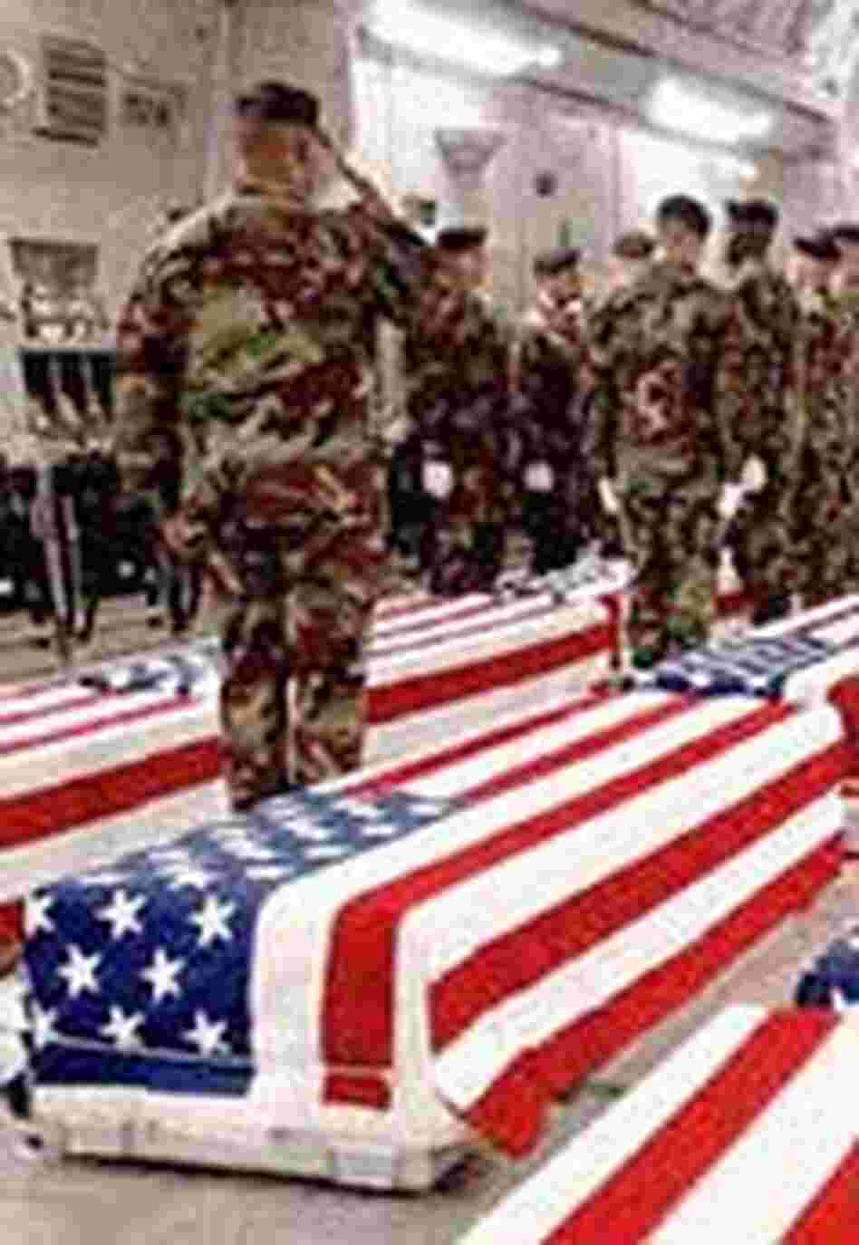 Caskets bearing U.S. soldiers unloaded at Dover Air Force Base