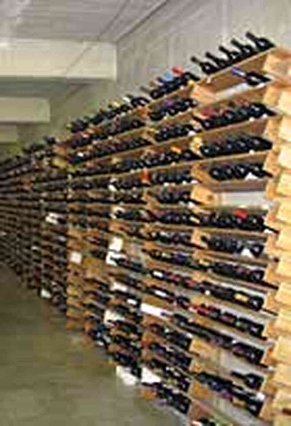 Racks of wine bottles awaiting tasting. Racks of wine bottles awaiting tasting.