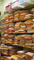 A wall of stacked PhD dissertations await the critical eye of UCLA professors. A wall of stacked PhD dissertations await the critical eye of UCLA professors.