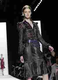 A model struts down a runway at a Fashion Week show in New York City. A model struts down a runway at a Fashion Week show in New York City.