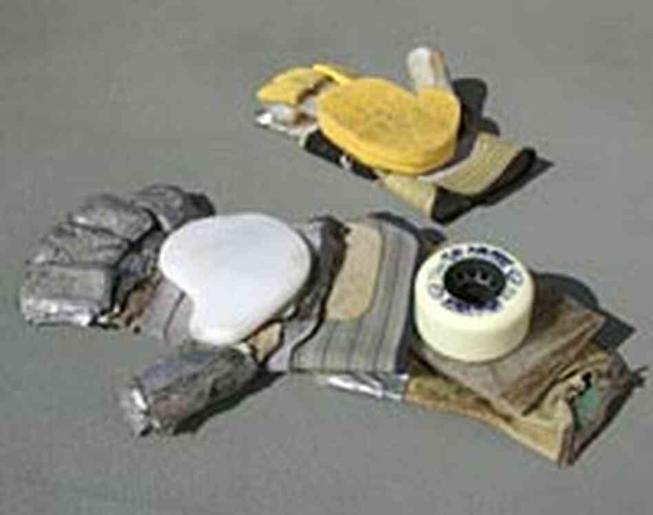 Tools of the trade -- blocks of plastic cemented to leather gloves. Tools of the trade -- blocks of plastic cemented to leather gloves.