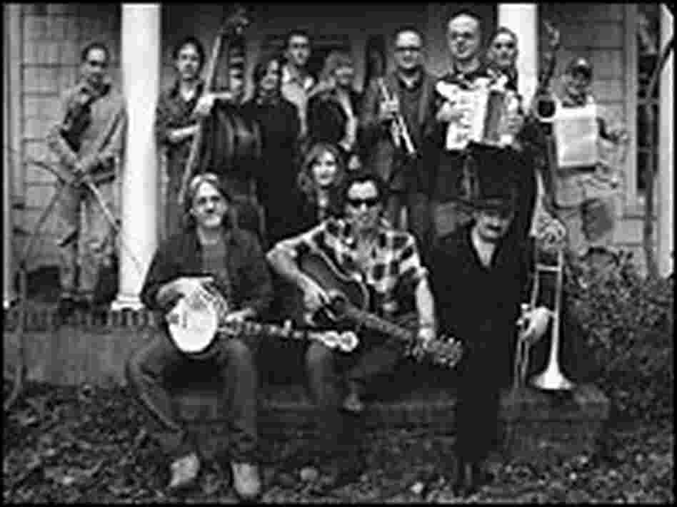Bruce Springsteen, center, with the musicians who collaborated on the Pete Seeger project.