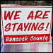 We are staying! sign in Hancock County. Credit: Howard Berkes, NPR.