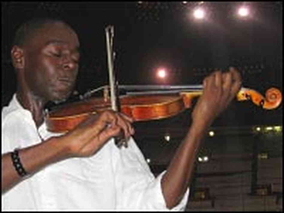 Samuel Thompson plays his violin inside the Superdome Samuel Thompson plays his violin inside the Superdome