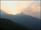 The sun sets over the snow-capped peaks of the Himalayas above the village of Satobri. The sun sets over the snow-capped peaks of the Himalayas above the village of Satobri.