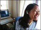 Lobsang Tsomo models an Internet phone headset. Lobsang Tsomo models an Internet phone headset.