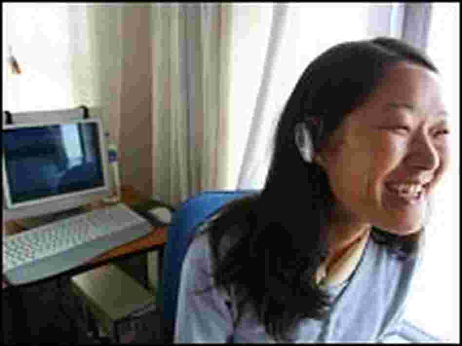 Lobsang Tsomo models an Internet phone headset.