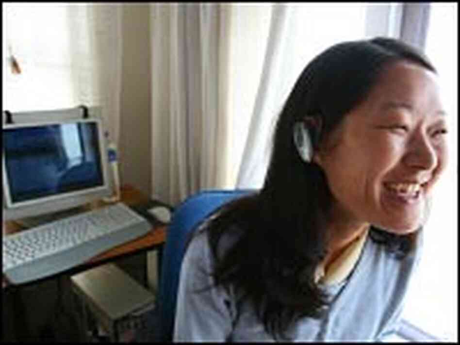 Lobsang Tsomo models an Internet phone headset.