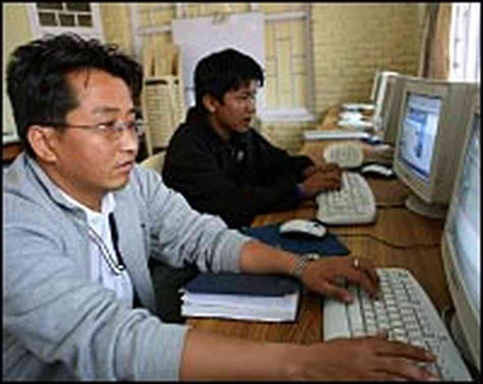 Both adults and children take computer classes at the technology center Both adults and children take computer classes at the technology center