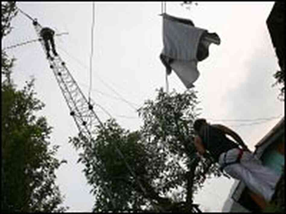 Yahel Ben-David, at top, adjusts a mesh antenna
