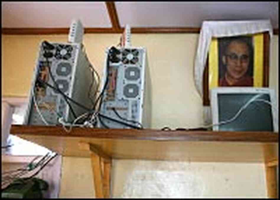 Web servers share shelf space with a portrait of the Dalai Lama. Web servers share shelf space with a portrait of the Dalai Lama.