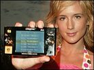 A model poses with the new TiVoToGo device. A model poses with the new TiVoToGo device.