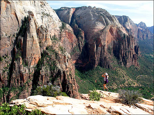 Hiker Lisa Miller looks tiny against the huge canyon walls.