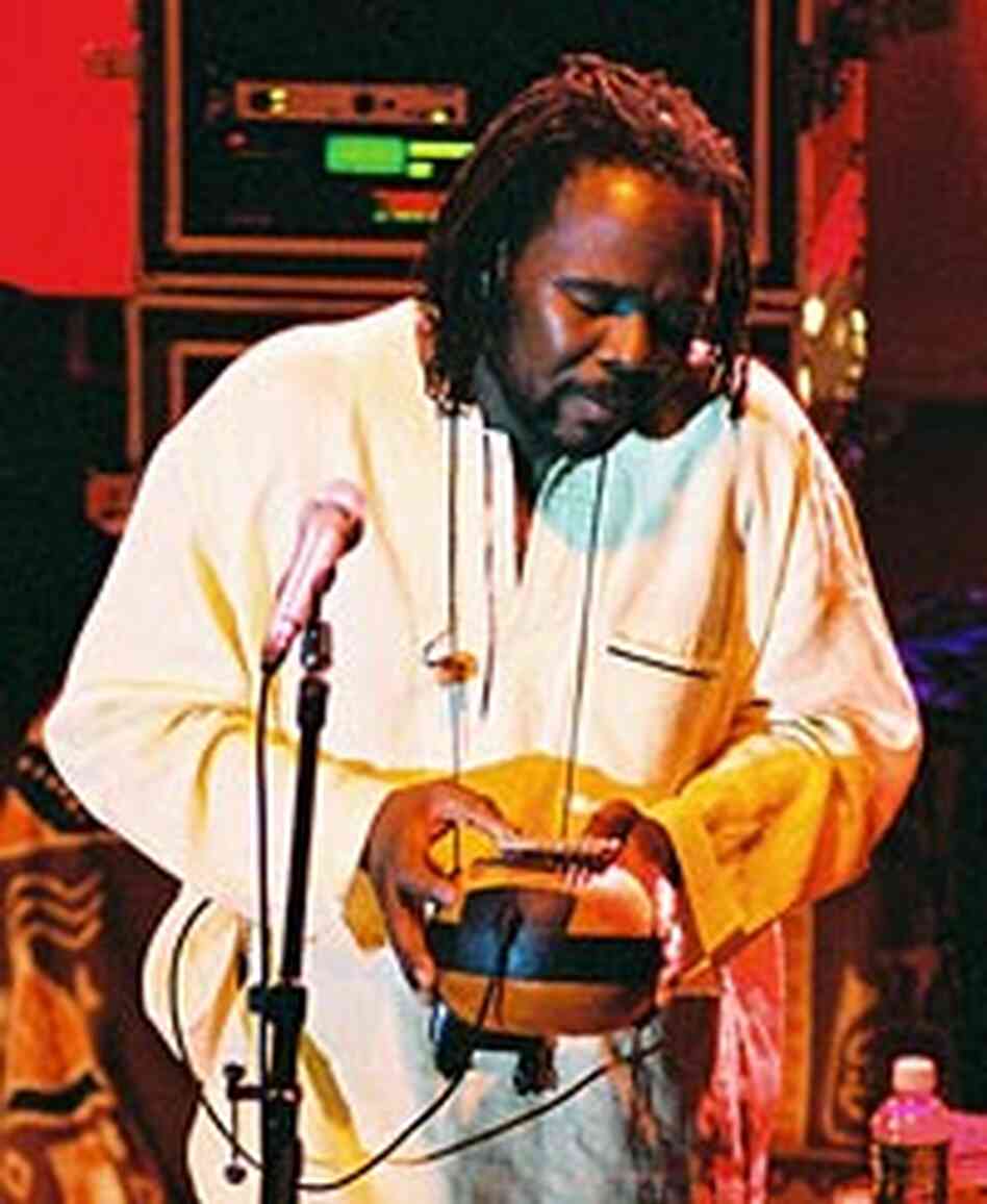 Samite plays the thumb piano for an audience at the State Theatre in Ithaca, N.Y. Samite plays the thumb piano for an audience at the State Theatre in Ithaca, N.Y.