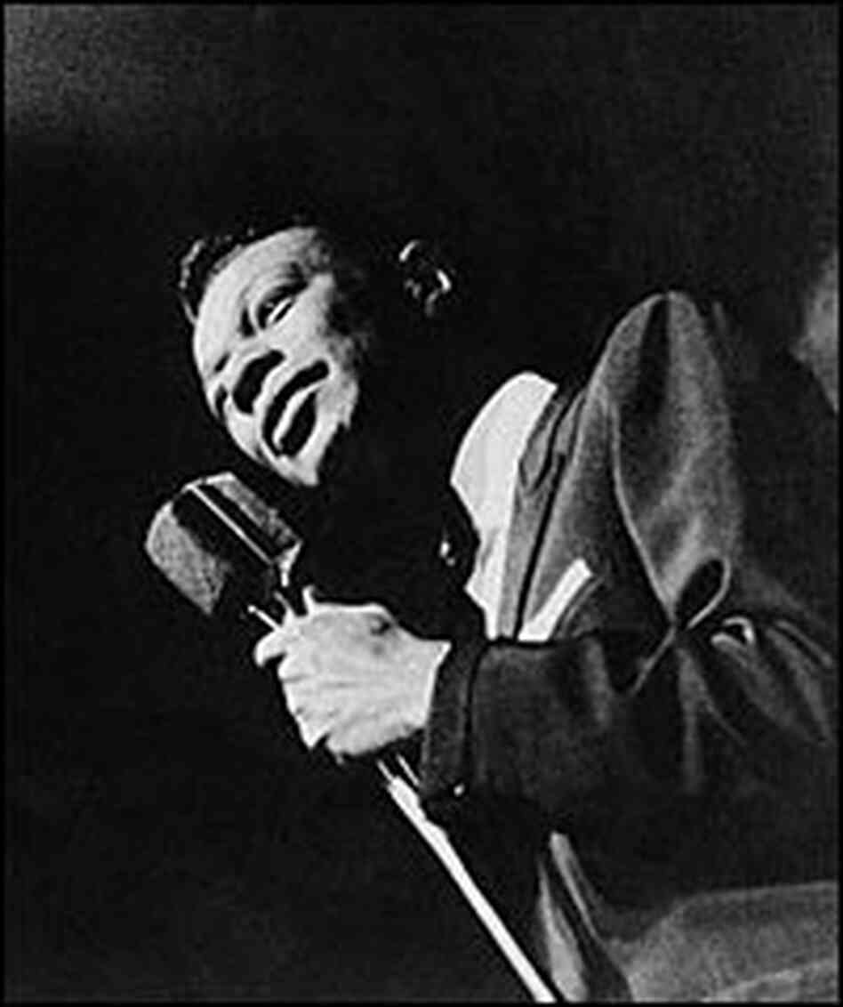Nat 'King' Cole performs to an audience in the 1950s. Nat 'King' Cole performs to an audience in the 1950s.