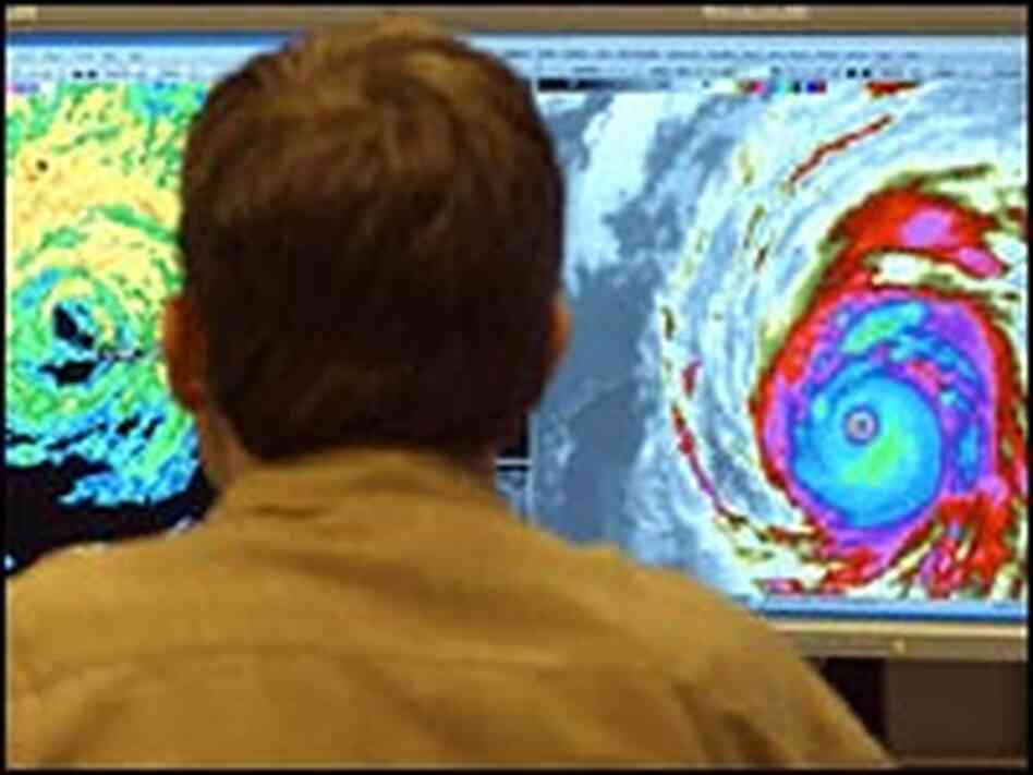 A meteorologist at the National Hurricane Center evaluates satellite data A meteorologist at the National Hurricane Center evaluates satellite data