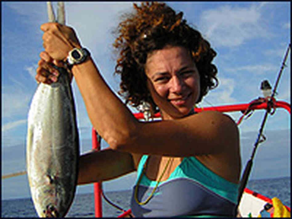 Julie Wafaei holds a dorado fish she caught while rowing across the Atlantic Ocean. Julie Wafaei holds a dorado fish she caught while rowing across the Atlantic Ocean.