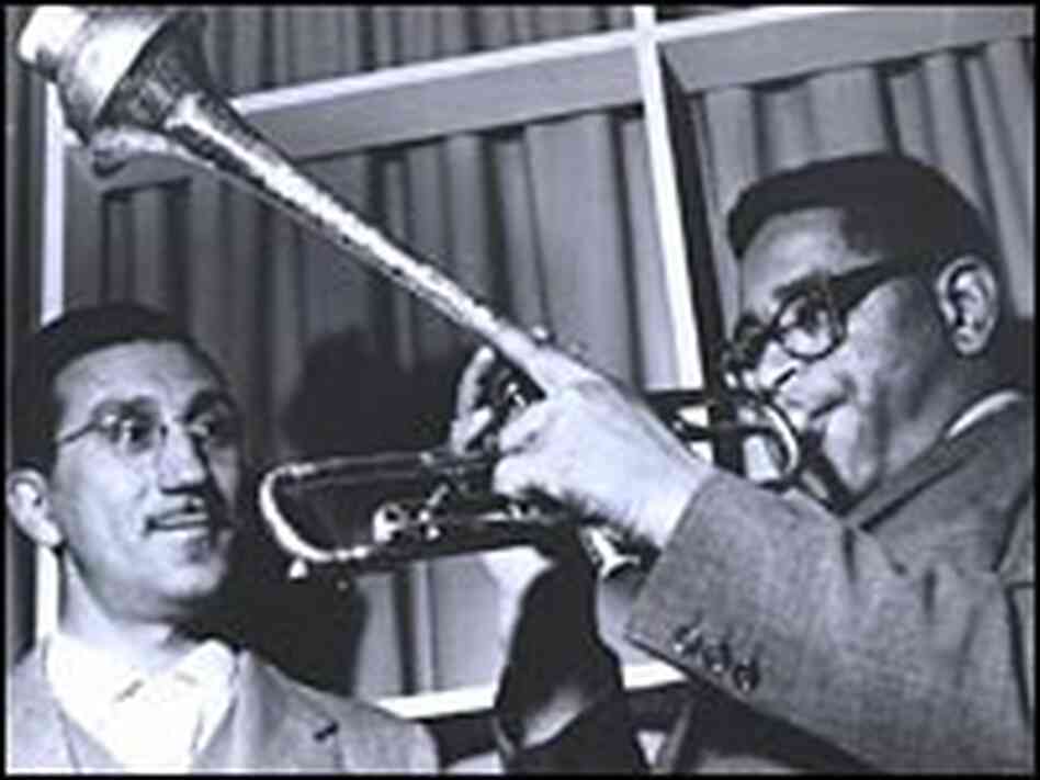Dizzy Gillespie demostrates his signature trumpet style on his world tour. Dizzy Gillespie demostrates his signature trumpet style on his world tour.