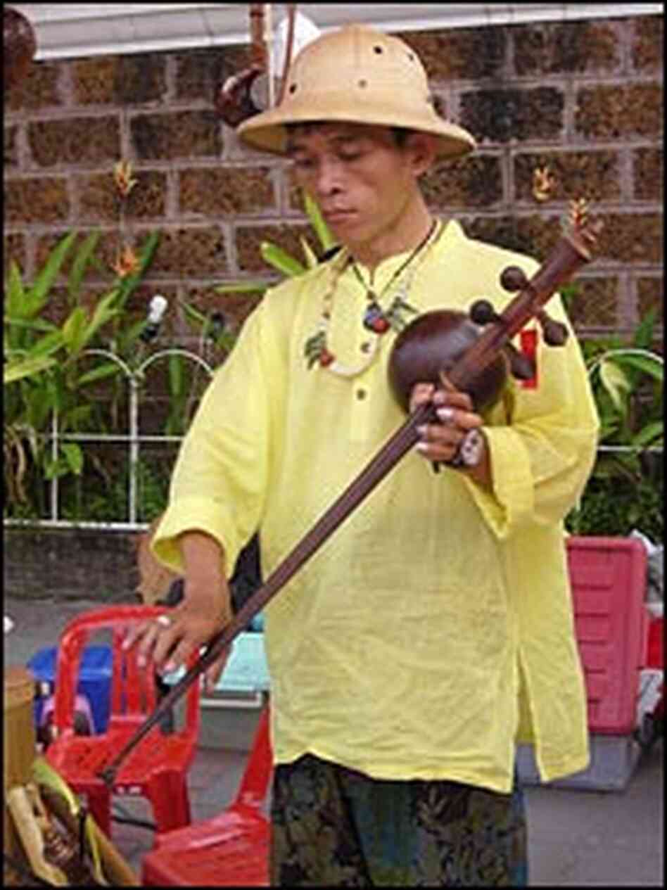 Manop Thammadoonpinij, a music teacher and luthier