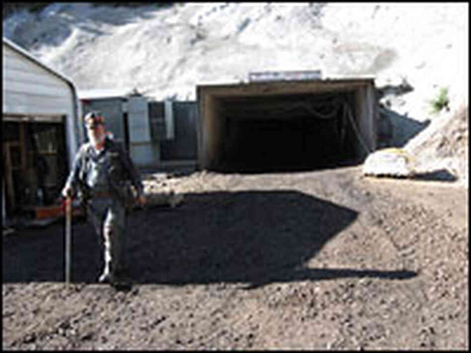 A miner walks away from the entrance to Crandall Canyon Mine. A miner walks away from the entrance to Crandall Canyon Mine.