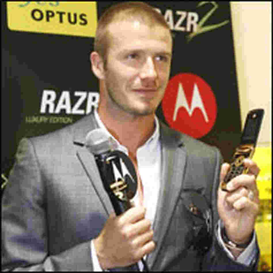David Beckham Holds Cell Phone David Beckham Holds Cell Phone