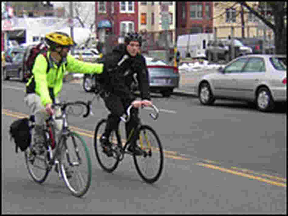 Dan Charles, left, rides with Vincent Betette in Washington, D.C.