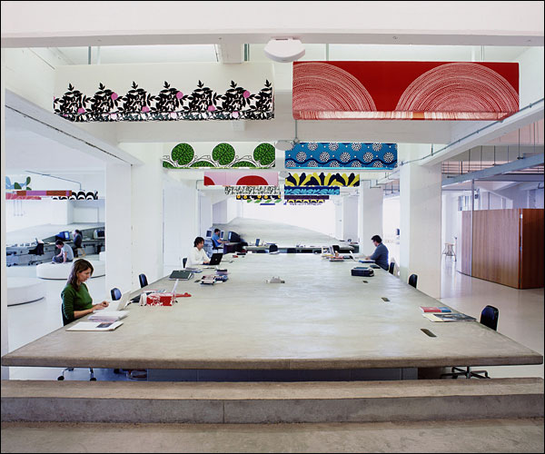 At the London advertising agency Mother, staffers work around a large table.