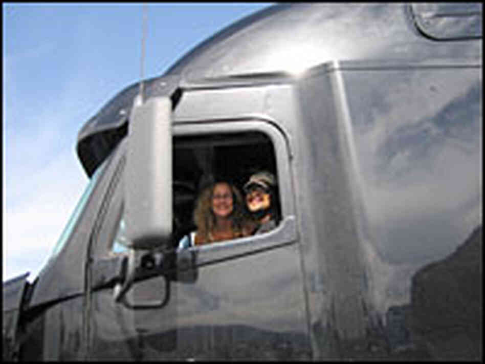 Solomon Scroggins and Beverly O'Mara smile from the window of their truck