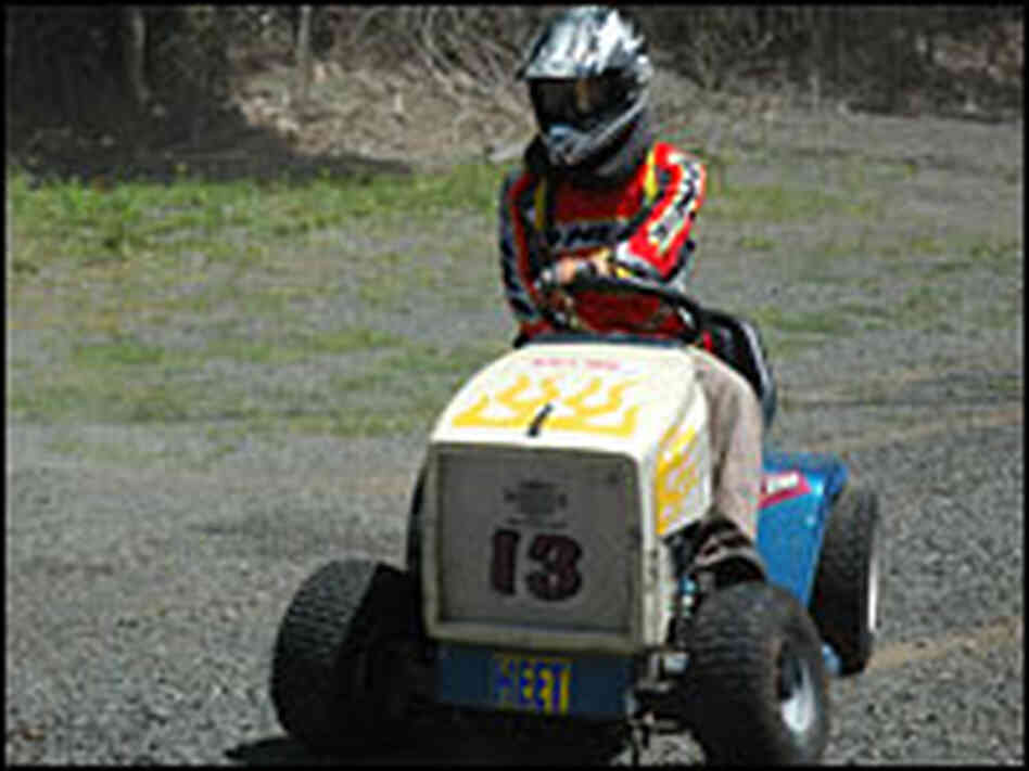 Kirk Frew, a mower-racing enthusiast, gives his mower a test drive. Kirk Frew, a mower-racing enthusiast, gives his mower a test drive.